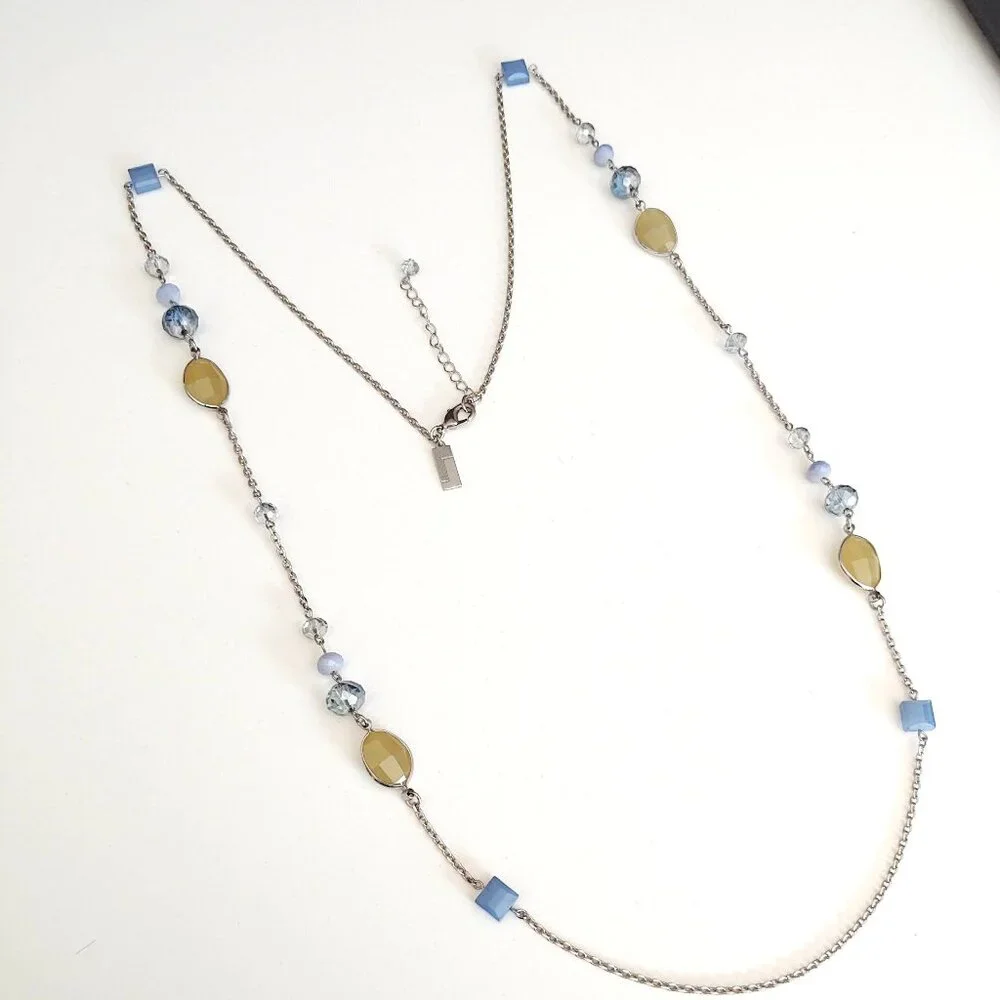 Long silver necklace with blue and yellow glass beads